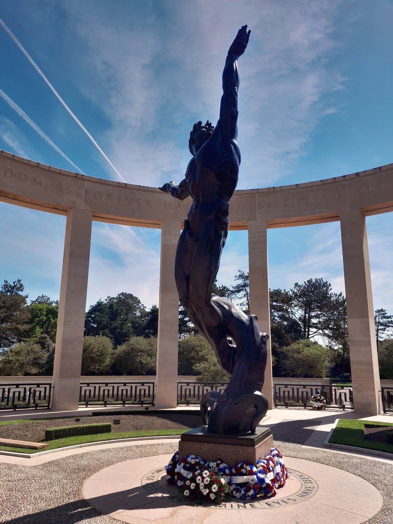 Bronze statue "Spirit of American Youth" reaching upward at Normandy American Cemetery, Colleville-sur-Mer, France.